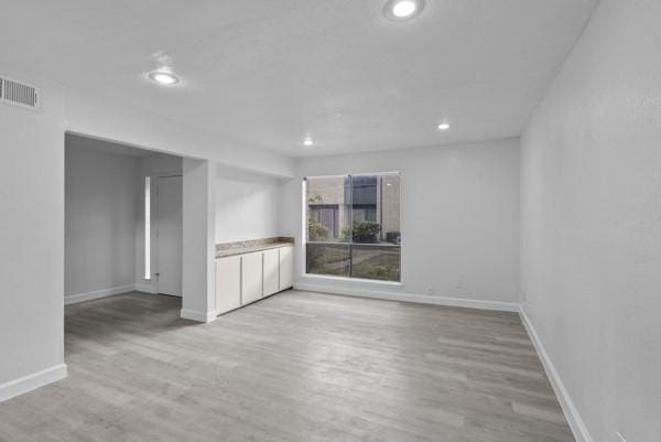 9005 Imogene St Unit C, Houston, TX 77036 - spare room featuring light wood-type flooring and recessed lighting
