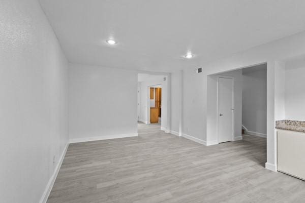 9005 Imogene St Unit C, Houston, TX 77036 - spare room featuring light wood-style flooring and recessed lighting