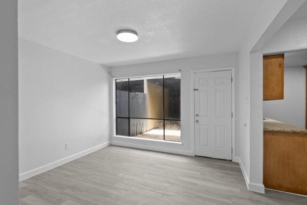 9005 Imogene St Unit C, Houston, TX 77036 - empty room with wood finished floors and baseboards