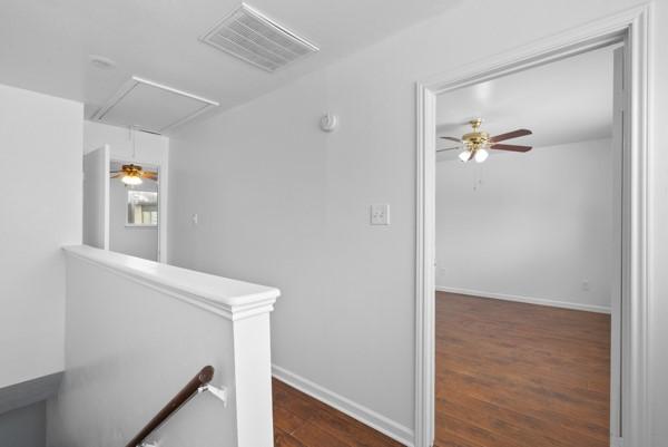 9005 Imogene St Unit C, Houston, TX 77036 - corridor with an upstairs landing, attic access, and dark wood finished floors