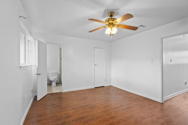 9005 Imogene St Unit C, Houston, TX 77036 - unfurnished bedroom with wood finished floors, ensuite bathroom, and ceiling fan