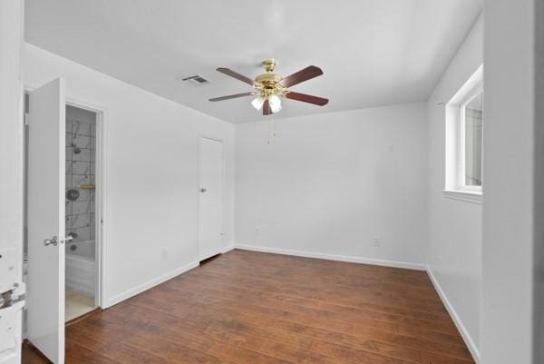 9005 Imogene St Unit C, Houston, TX 77036 - unfurnished bedroom featuring wood finished floors and a ceiling fan