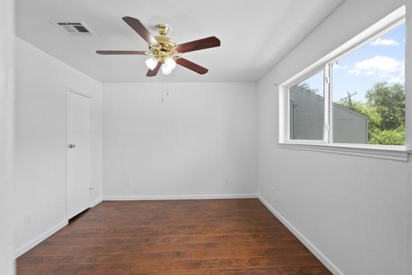 9005 Imogene St Unit C, Houston, TX 77036 - spare room featuring ceiling fan and wood finished floors