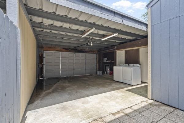 9005 Imogene St Unit C, Houston, TX 77036 - garage with washer and dryer and a garage door opener