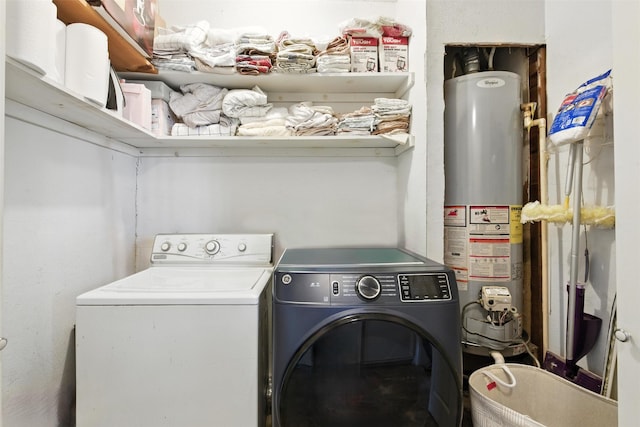 619 10th St, Hempstead, TX 77445 - washroom with water heater and washer and dryer