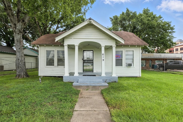 619 10th St, Hempstead, TX 77445 - view of front of property with a porch, roof with shingles, and cooling unit