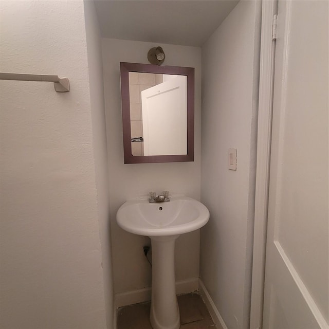 1814 Gano St, Houston, TX 77009 - bathroom featuring a sink and baseboards