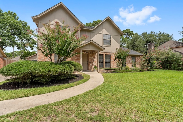 2811 Blue Glen Ln, Houston, TX 77073 - view of front of property featuring brick siding, a front lawn, and stucco siding