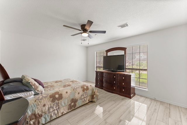 2811 Blue Glen Ln, Houston, TX 77073 - bedroom featuring multiple windows, wood finish floors, and ceiling fan