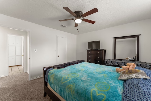 2811 Blue Glen Ln, Houston, TX 77073 - bedroom featuring carpet, a ceiling fan, and a textured ceiling