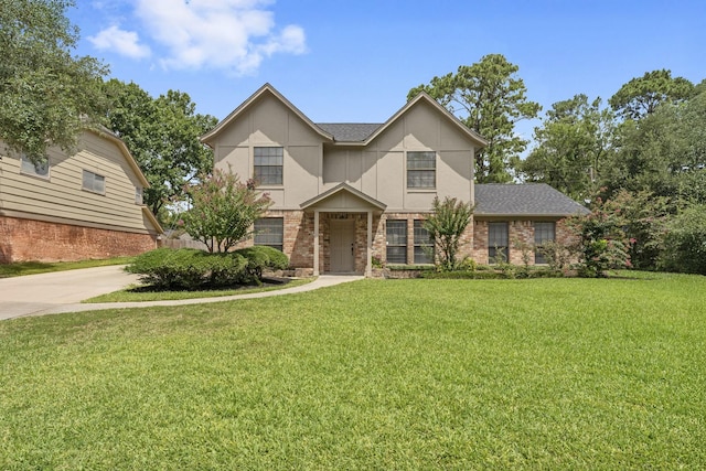 2811 Blue Glen Ln, Houston, TX 77073 - view of front of house featuring a front yard, brick siding, and a shingled roof