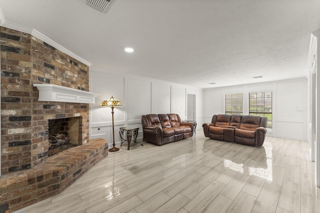 2811 Blue Glen Ln, Houston, TX 77073 - living room featuring a decorative wall, ornamental molding, a brick fireplace, and wood finished floors
