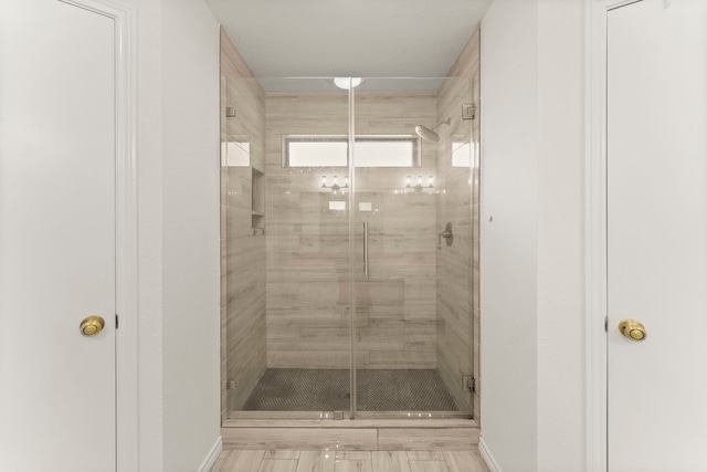 2811 Blue Glen Ln, Houston, TX 77073 - bathroom featuring a stall shower and baseboards