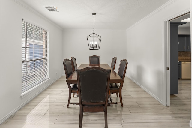 2811 Blue Glen Ln, Houston, TX 77073 - dining room featuring a chandelier, crown molding, and light wood finished floors
