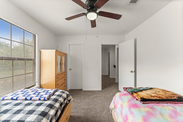 2811 Blue Glen Ln, Houston, TX 77073 - carpeted bedroom with baseboards and a ceiling fan