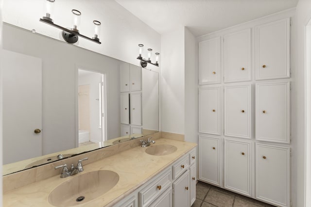 2811 Blue Glen Ln, Houston, TX 77073 - bathroom featuring double vanity, tile patterned floors, and a closet