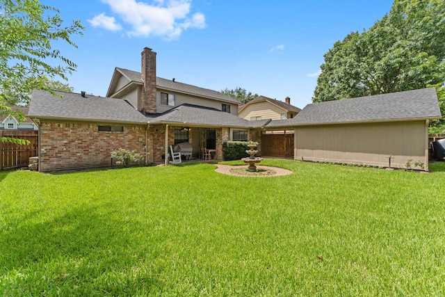 2811 Blue Glen Ln, Houston, TX 77073 - back of property with a chimney, brick siding, and a shingled roof