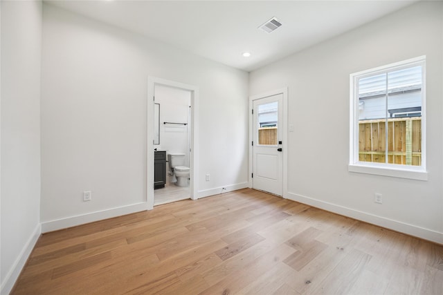 5506B Wheatley St, Houston, TX 77091 - unfurnished bedroom with light wood finished floors, recessed lighting, and ensuite bath
