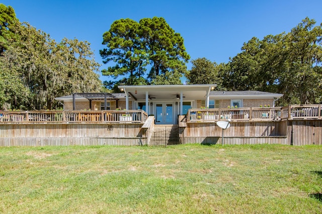 150 Edgewater Way, Point Blank, TX 77364 - rear view of property featuring a wooden deck, ceiling fan, a yard, and brick siding