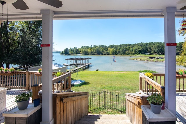150 Edgewater Way, Point Blank, TX 77364 - wooden deck featuring a water view, a lawn, and a ceiling fan