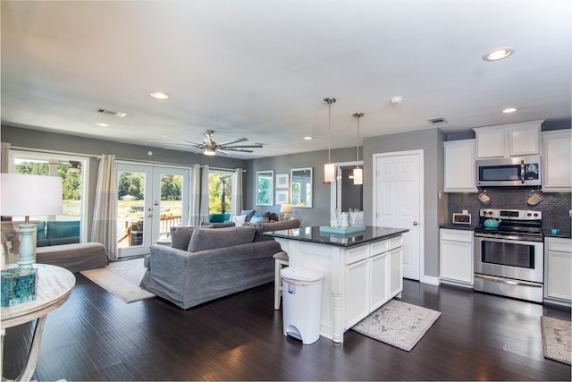 150 Edgewater Way, Point Blank, TX 77364 - kitchen featuring stainless steel appliances, open floor plan, french doors, plenty of natural light, and recessed lighting