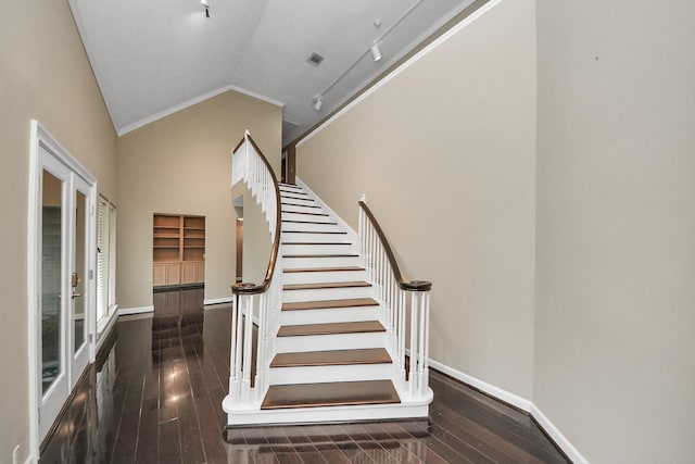 606 Montclair Blvd, Sugar Land, TX 77478 - staircase with wood-type flooring, ornamental molding, track lighting, and high vaulted ceiling
