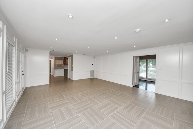 606 Montclair Blvd, Sugar Land, TX 77478 - unfurnished room featuring a decorative wall and recessed lighting