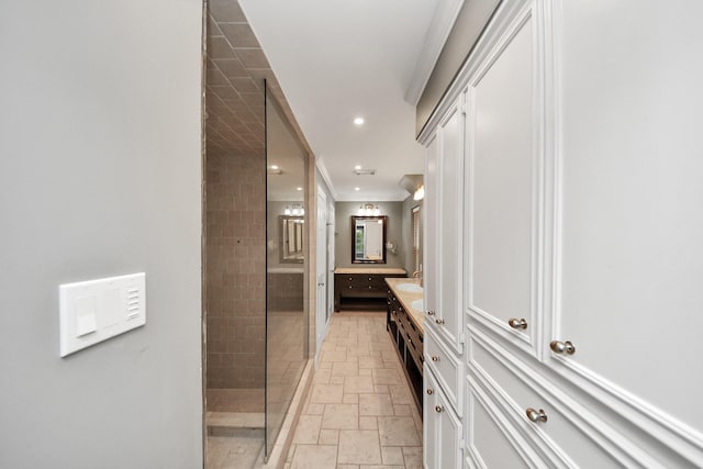 606 Montclair Blvd, Sugar Land, TX 77478 - bathroom with stone tile flooring, double vanity, tiled shower, recessed lighting, and crown molding