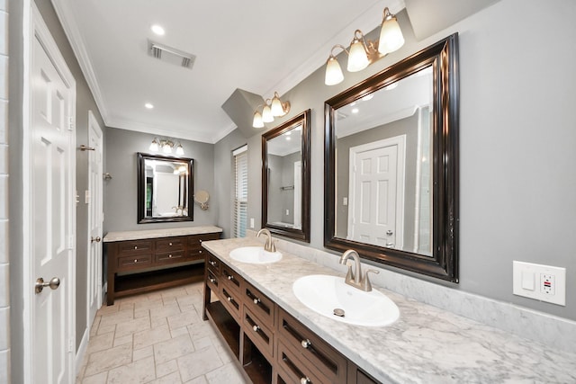 606 Montclair Blvd, Sugar Land, TX 77478 - bathroom featuring ornamental molding, double vanity, stone tile flooring, and recessed lighting
