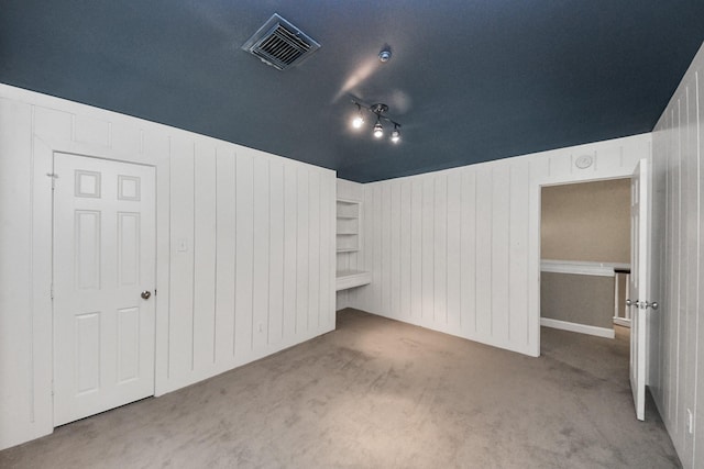 606 Montclair Blvd, Sugar Land, TX 77478 - unfurnished bedroom with carpet and wood walls