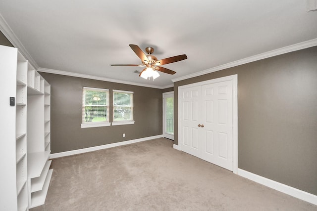606 Montclair Blvd, Sugar Land, TX 77478 - unfurnished bedroom featuring light carpet, ornamental molding, a ceiling fan, and a closet