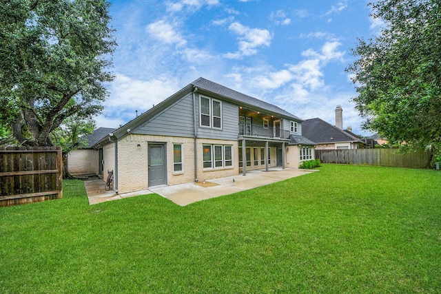 606 Montclair Blvd, Sugar Land, TX 77478 - back of house with a balcony, a fenced backyard, a patio area, and brick siding