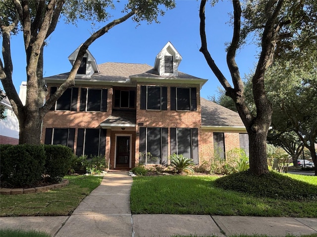 17427 Marigold Dr, Sugar Land, TX 77479 - view of front of home with brick siding and a front yard