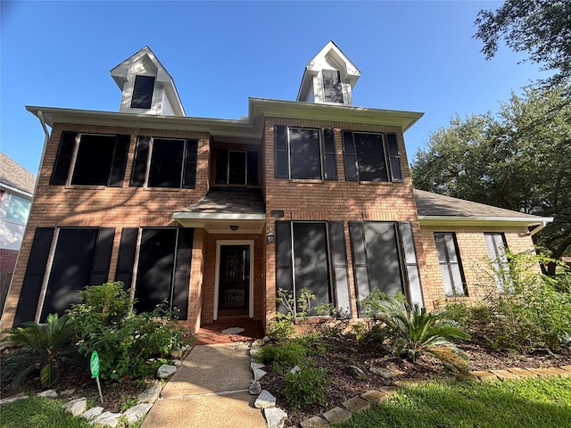 17427 Marigold Dr, Sugar Land, TX 77479 - view of front of house with brick siding and a sunroom