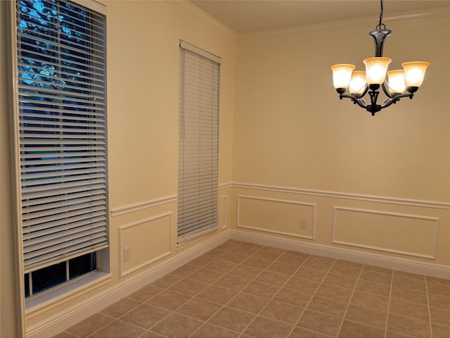 17427 Marigold Dr, Sugar Land, TX 77479 - unfurnished dining area with a chandelier, tile patterned flooring, ornamental molding, a wainscoted wall, and a decorative wall