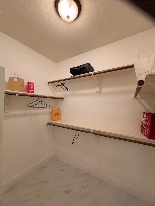 17427 Marigold Dr, Sugar Land, TX 77479 - walk in closet with marble finish floors