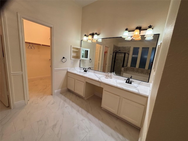 17427 Marigold Dr, Sugar Land, TX 77479 - full bath featuring a stall shower, marble finish floors, double vanity, a spacious closet, and a chandelier