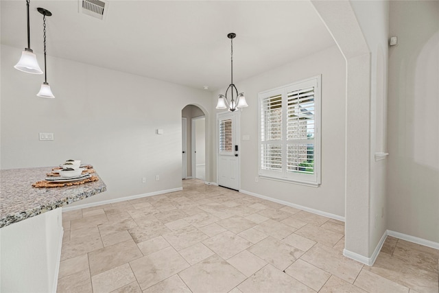 3102 Hillside Landing Trl, Katy, TX 77494 - unfurnished dining area featuring arched walkways and baseboards
