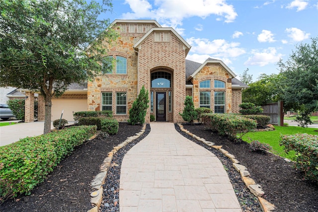 3102 Hillside Landing Trl, Katy, TX 77494 - view of front of property with driveway, brick siding, and stone siding