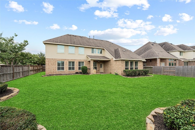 3102 Hillside Landing Trl, Katy, TX 77494 - back of property with brick siding and a fenced backyard