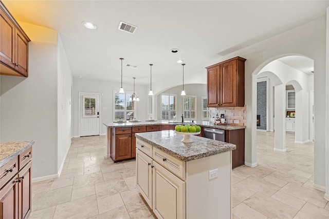3102 Hillside Landing Trl, Katy, TX 77494 - kitchen with a peninsula, dishwasher, a kitchen island, recessed lighting, and light stone countertops