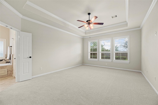 3102 Hillside Landing Trl, Katy, TX 77494 - unfurnished room featuring a raised ceiling, a ceiling fan, light carpet, and ornamental molding