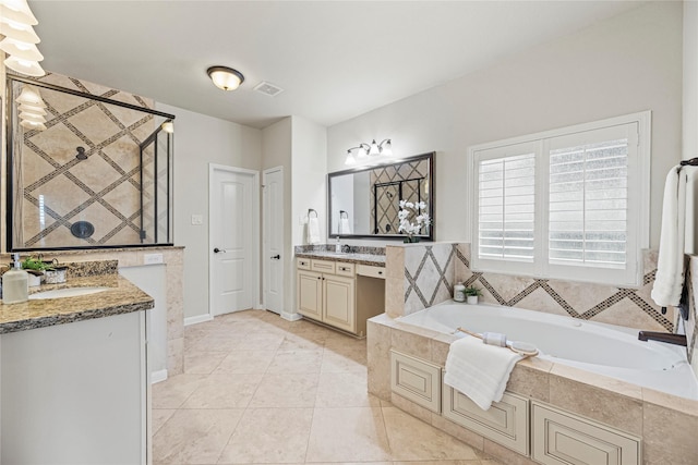 3102 Hillside Landing Trl, Katy, TX 77494 - bathroom with two vanities, a bath, and tile patterned floors