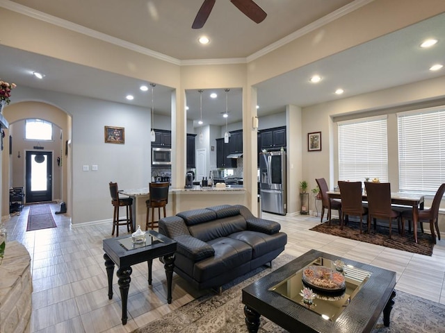 6127 Rosehill Harvest Loop, Katy, TX 77493 - living room featuring arched walkways, ceiling fan, crown molding, and recessed lighting