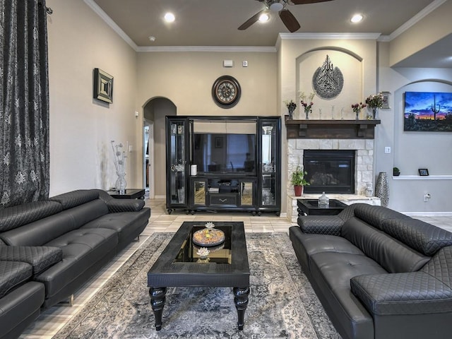 6127 Rosehill Harvest Loop, Katy, TX 77493 - living area with a ceiling fan, ornamental molding, arched walkways, recessed lighting, and a fireplace