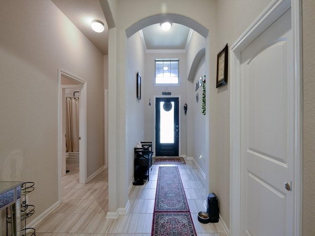 6127 Rosehill Harvest Loop, Katy, TX 77493 - foyer entrance featuring arched walkways, crown molding, and light tile patterned floors