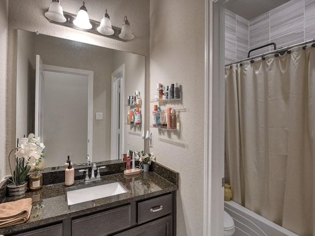 6127 Rosehill Harvest Loop, Katy, TX 77493 - full bath featuring a textured wall, vanity, and shower / bathtub combination with curtain