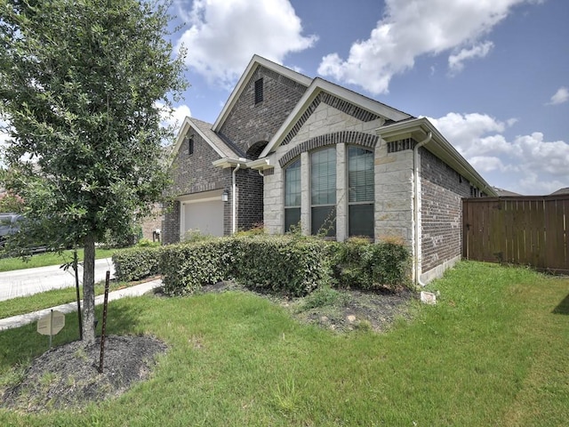 6127 Rosehill Harvest Loop, Katy, TX 77493 - view of front of house with stone siding, a garage, and brick siding
