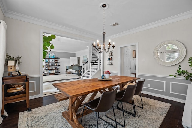 2413 Sawgrass Ct, League City, TX 77573 - dining space featuring stairway, a chandelier, crown molding, dark wood finished floors, and a wainscoted wall