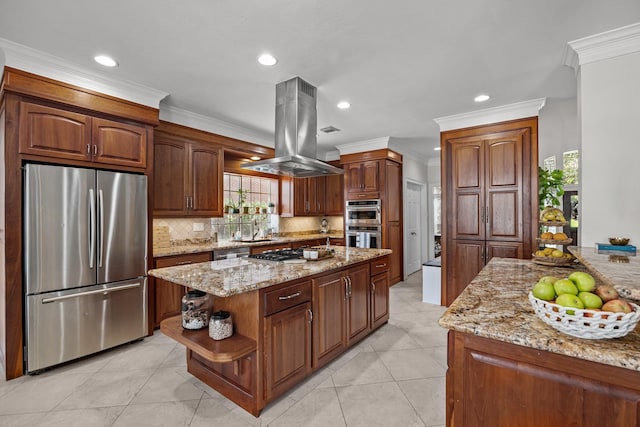 2413 Sawgrass Ct, League City, TX 77573 - kitchen with appliances with stainless steel finishes, island range hood, decorative backsplash, ornamental molding, and light stone counters